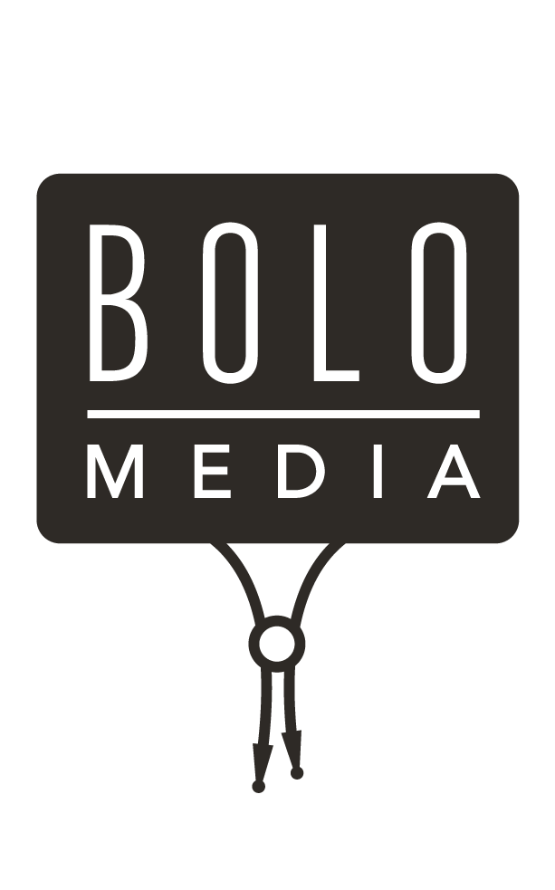 Bolo Media — a sign hanging from a bolo tie